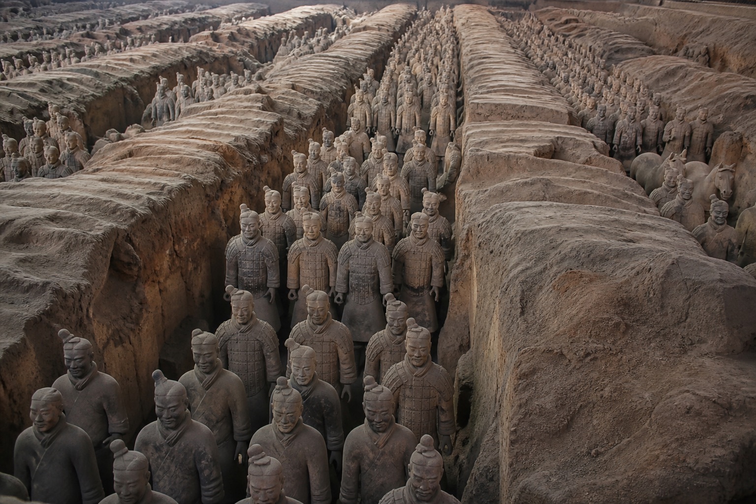 A sweeping view of authentic Terracotta Army figures in the archaeological pits of Xi'an